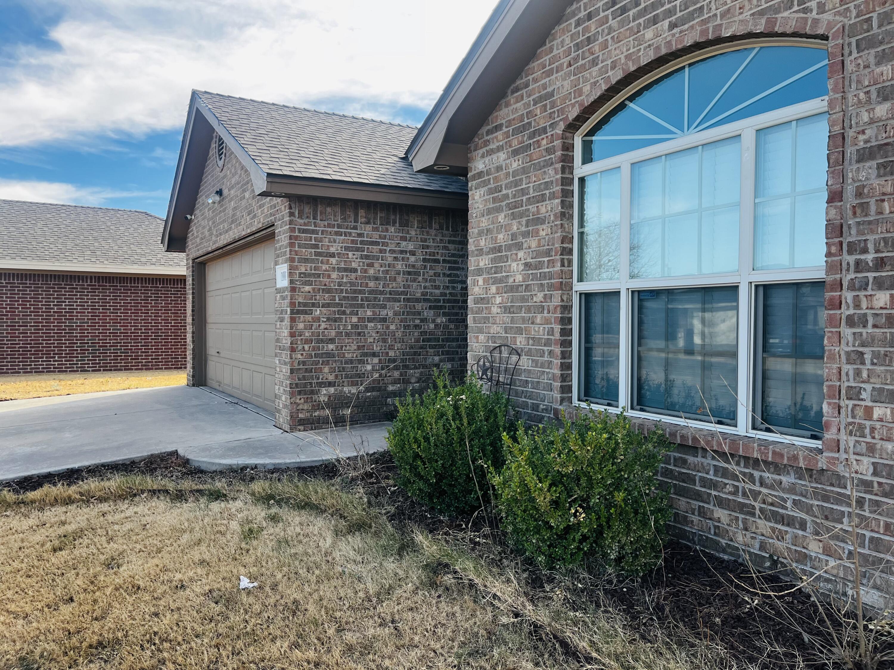 10016 Weatherford Avenue Lubbock, TX 79423 - Photo 29 of 29 a view of brick house with large windows