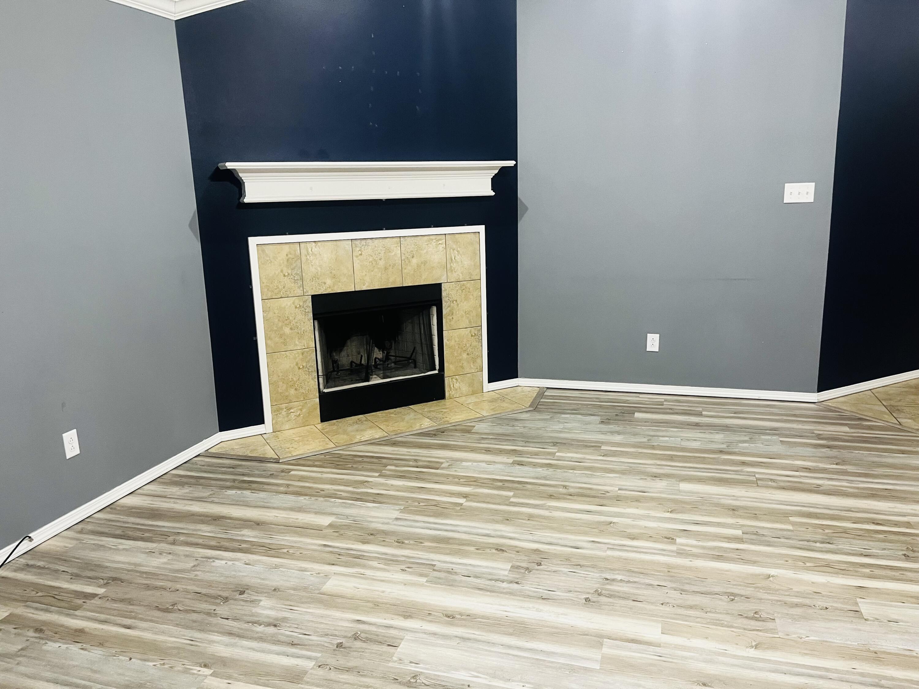 10016 Weatherford Avenue Lubbock, TX 79423 - Photo 8 of 29 a view of empty room with wooden floor