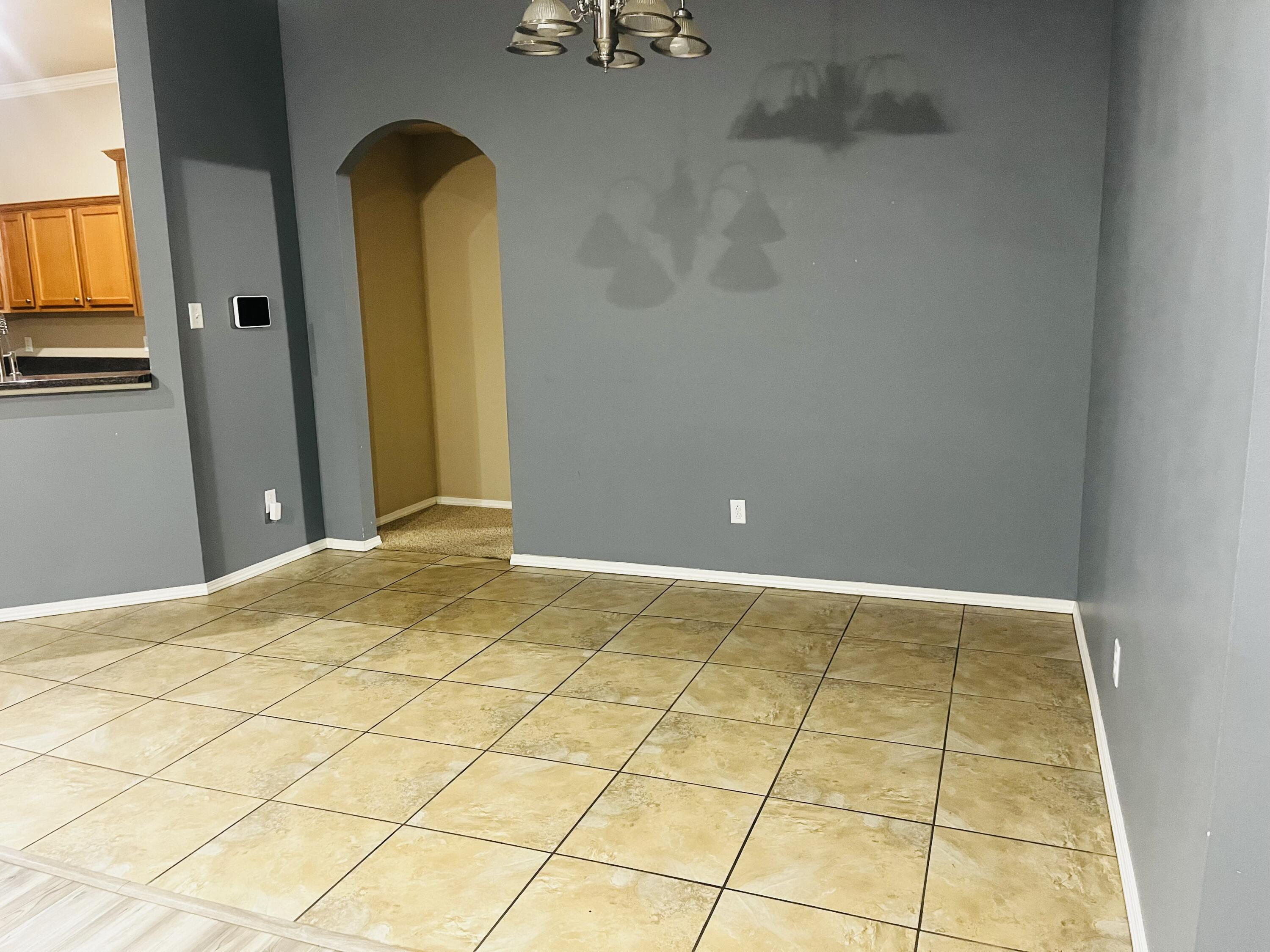 10016 Weatherford Avenue Lubbock, TX 79423 - Photo 10 of 29 a view of a room with a wardrobe