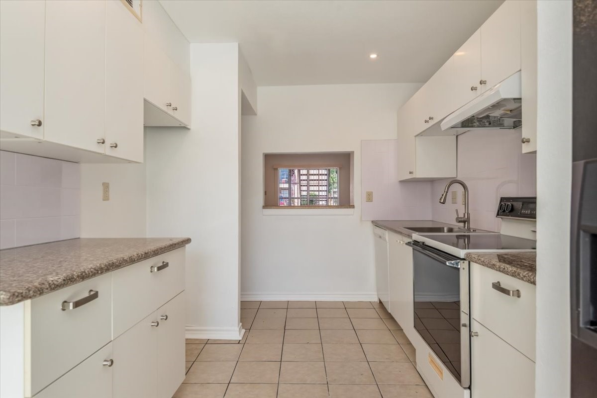 9616 Long Point Road, Unit 63 Houston, TX 77055 - Photo 8 of 17 Bright kitchen with abundant storage and easy access to outdoor living space.