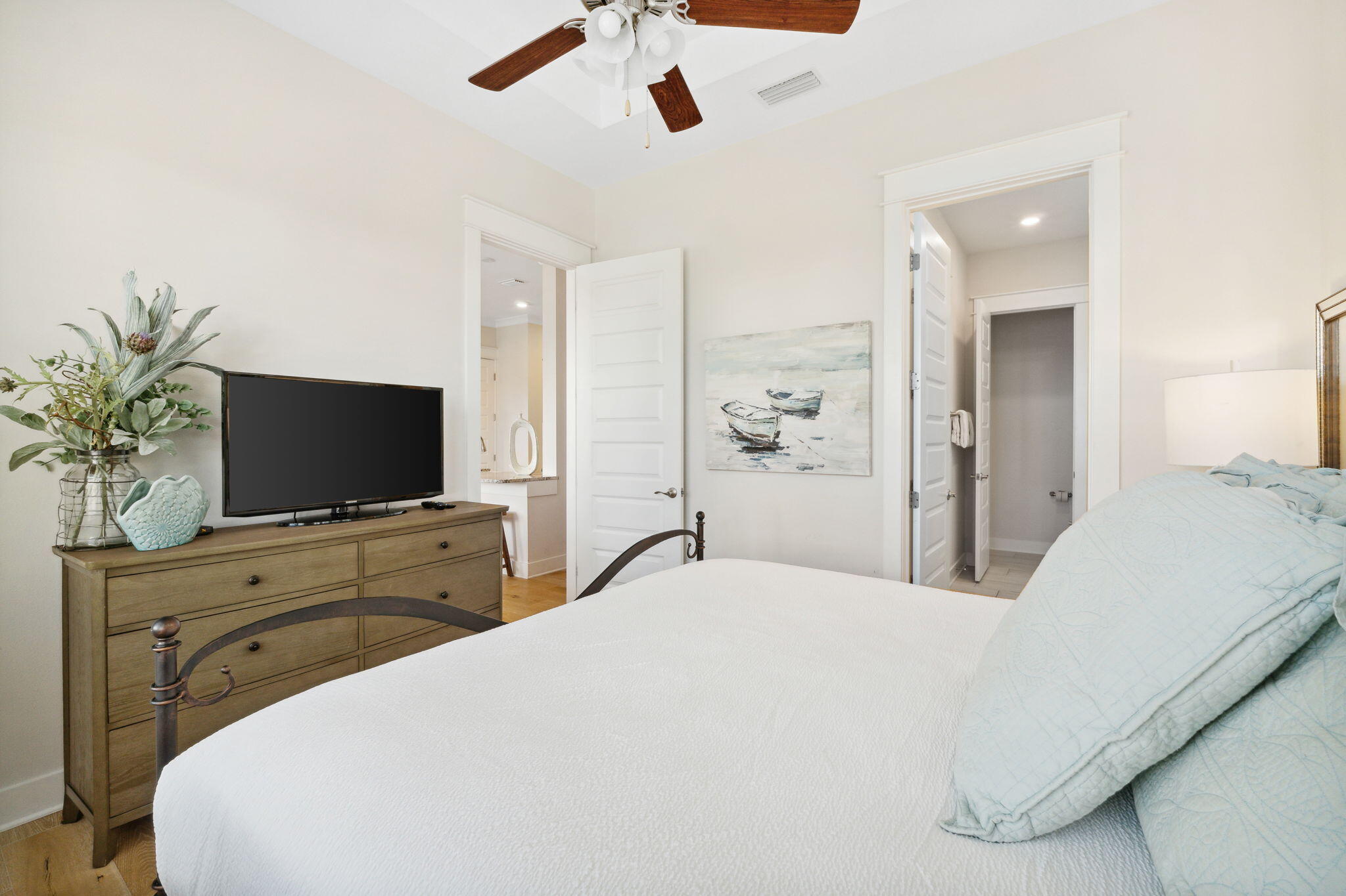117 West W Pine, Unit C Inlet Beach, FL 32461 - Photo 18 of 45 a bedroom with a bed and a flat screen tv