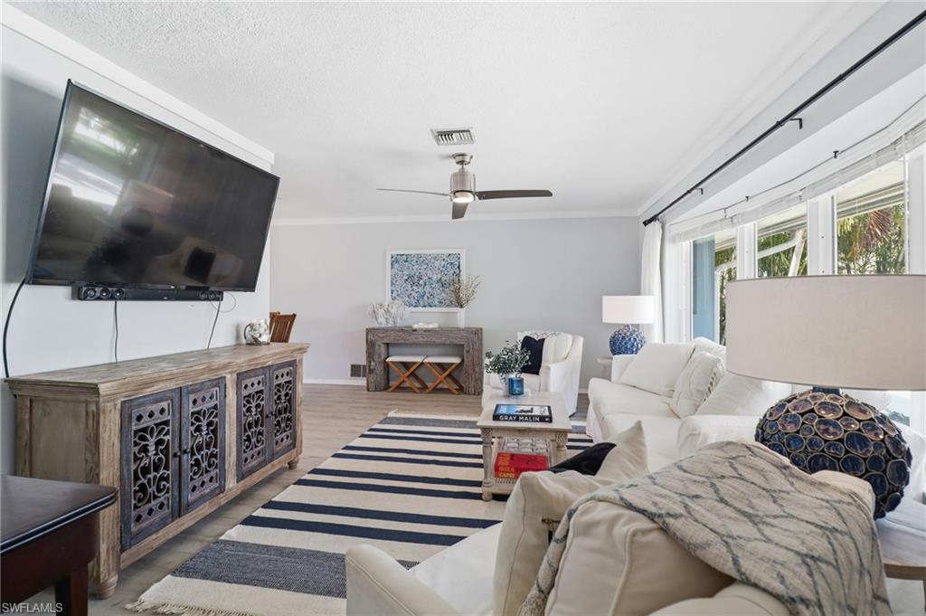 2211 Bayview Road Punta Gorda, FL 33950 - Photo 14 of 37 a living room with furniture and a flat screen tv