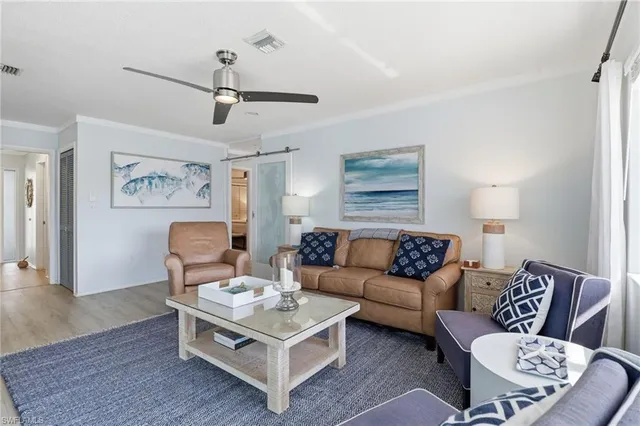 a living room with furniture and a rug