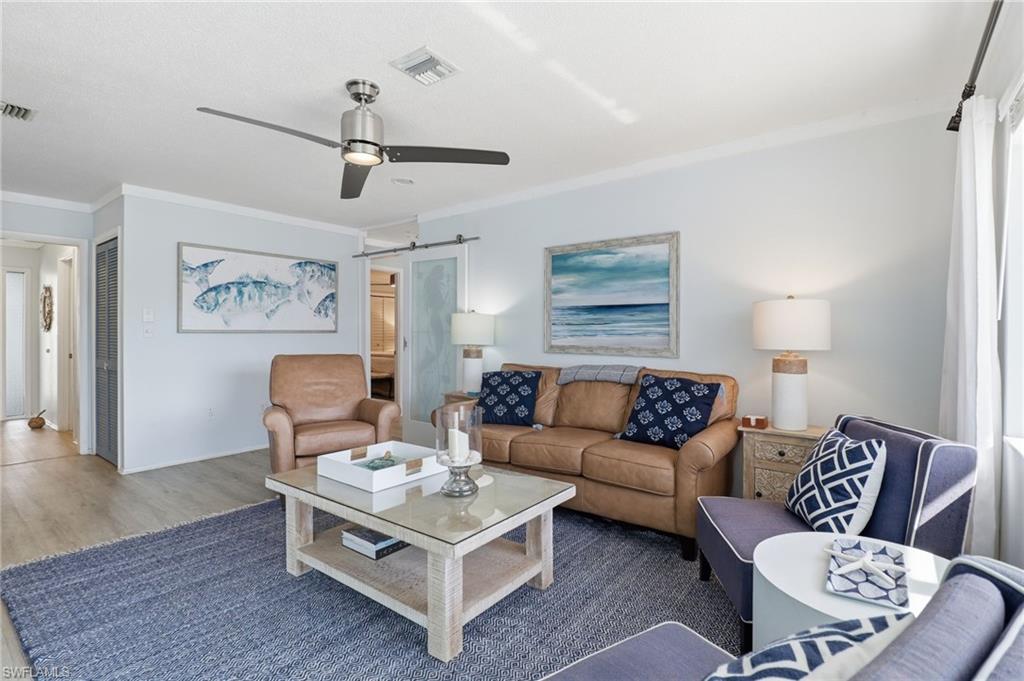 2211 Bayview Road Punta Gorda, FL 33950 - Photo 17 of 37 a living room with furniture and a rug