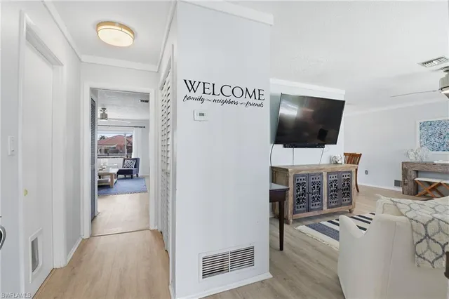 a view of a livingroom with furniture and flat screen tv