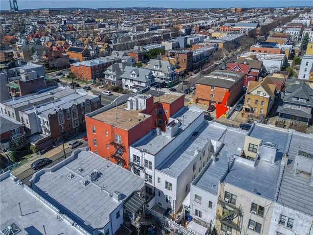 an aerial view of a city with lots of residential buildings