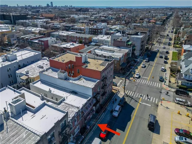 an aerial view of a city with lots of residential buildings
