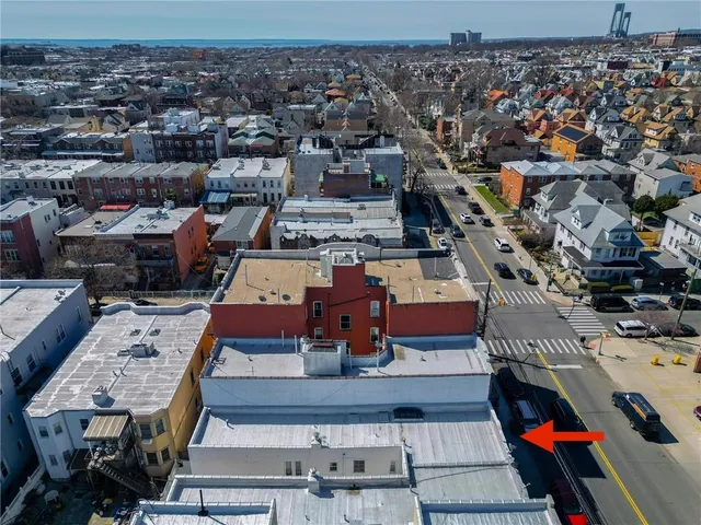 an aerial view of a balcony with chairs