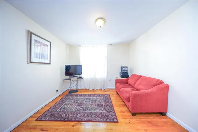 a living room with furniture and a rug