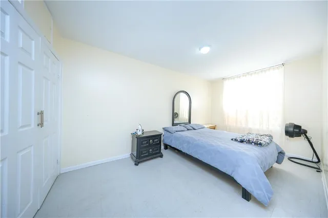 a bedroom with a bed and a sink