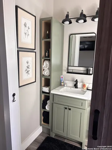 a bathroom with a sink and a mirror