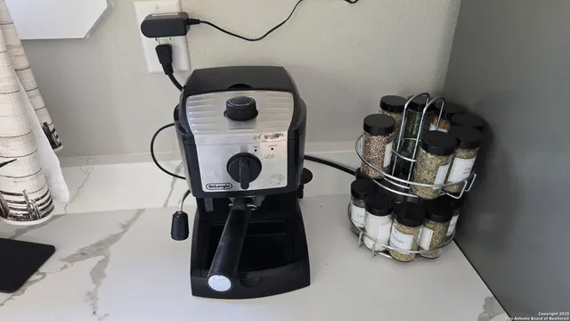 a roof deck with table and chairs