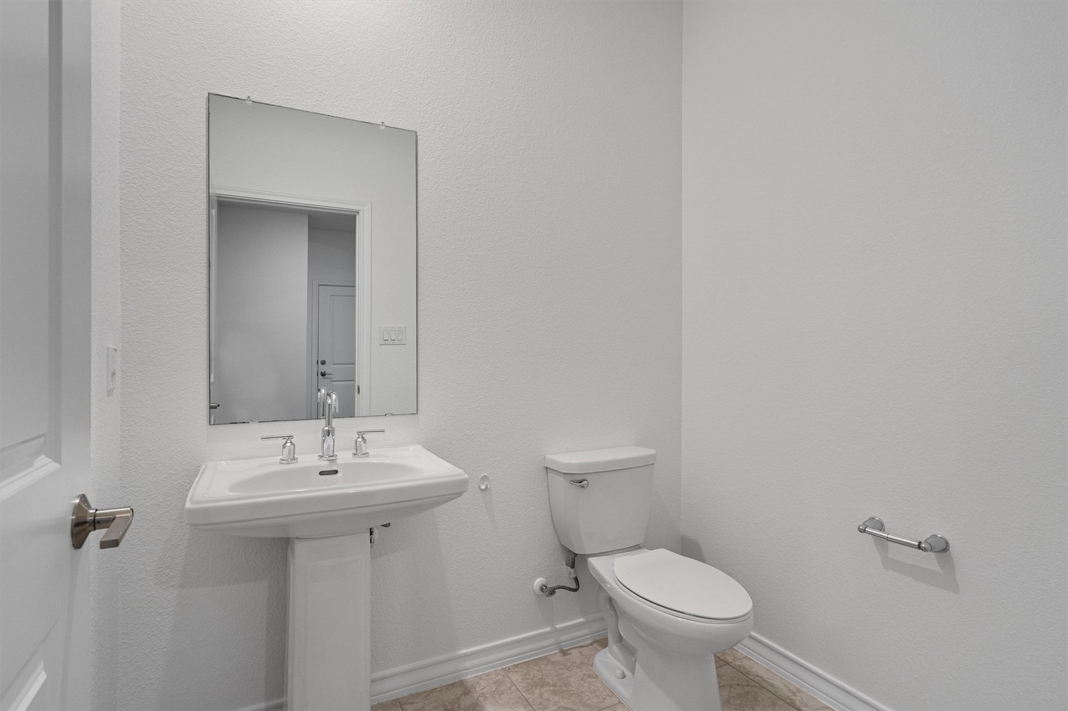 104 Stinchcomb Road Hutto, TX 78634 - Photo 29 of 40 Half Bath is conveniently located near Bedroom 4 and the main living areas, making it ideal for guests and everyday use.
