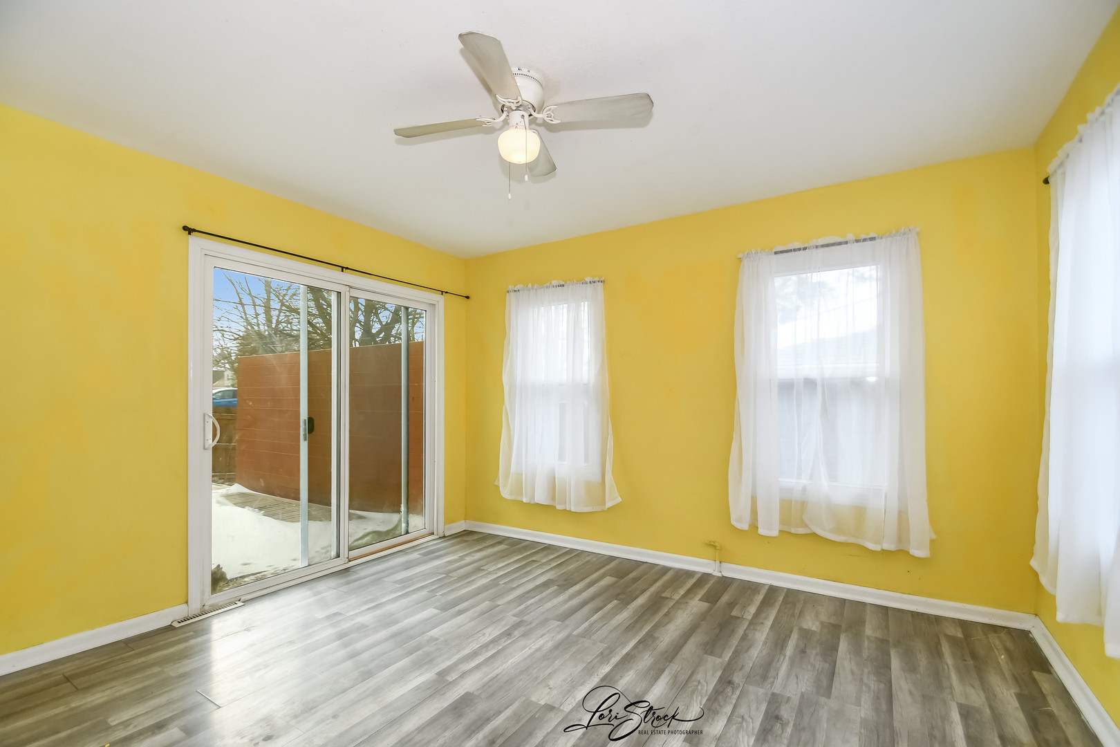 1009 Helen Avenue Joliet, IL 60433 - Photo 17 of 23 a view of an empty room with a window and wooden floor