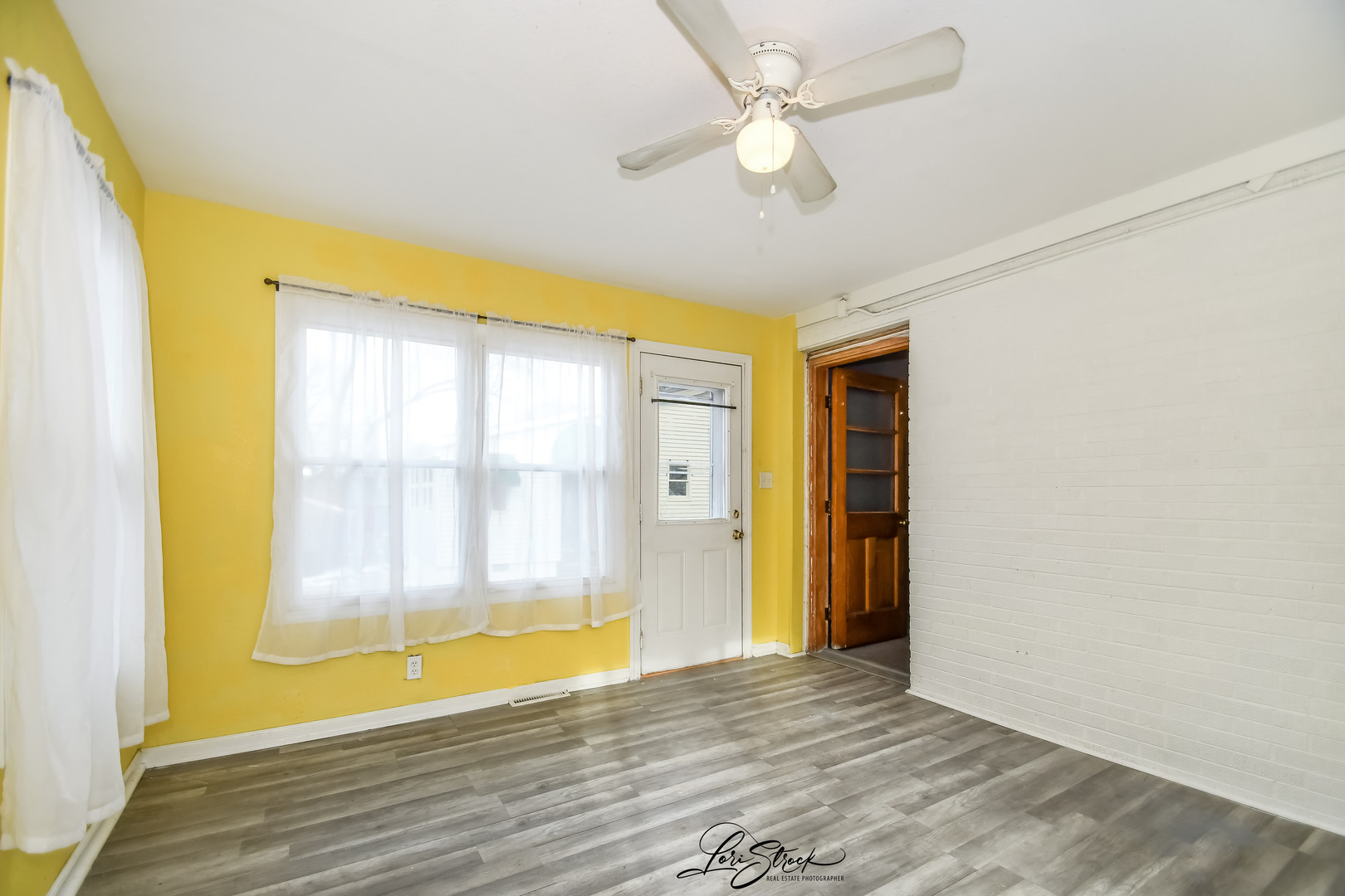 1009 Helen Avenue Joliet, IL 60433 - Photo 18 of 23 a view of an empty room with wooden floor and a window