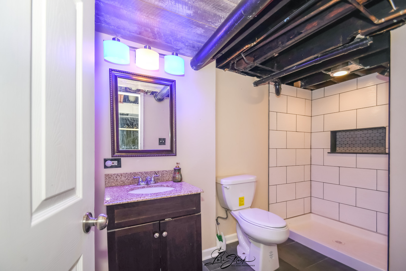 1009 Helen Avenue Joliet, IL 60433 - Photo 21 of 23 a bathroom with a granite countertop toilet sink and mirror