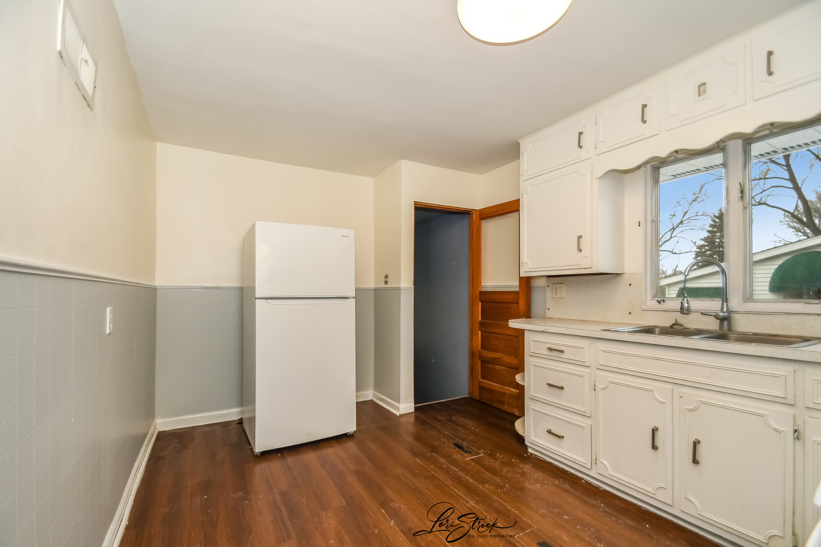 1009 Helen Avenue Joliet, IL 60433 - Photo 9 of 23 a kitchen with a refrigerator sink and cabinets