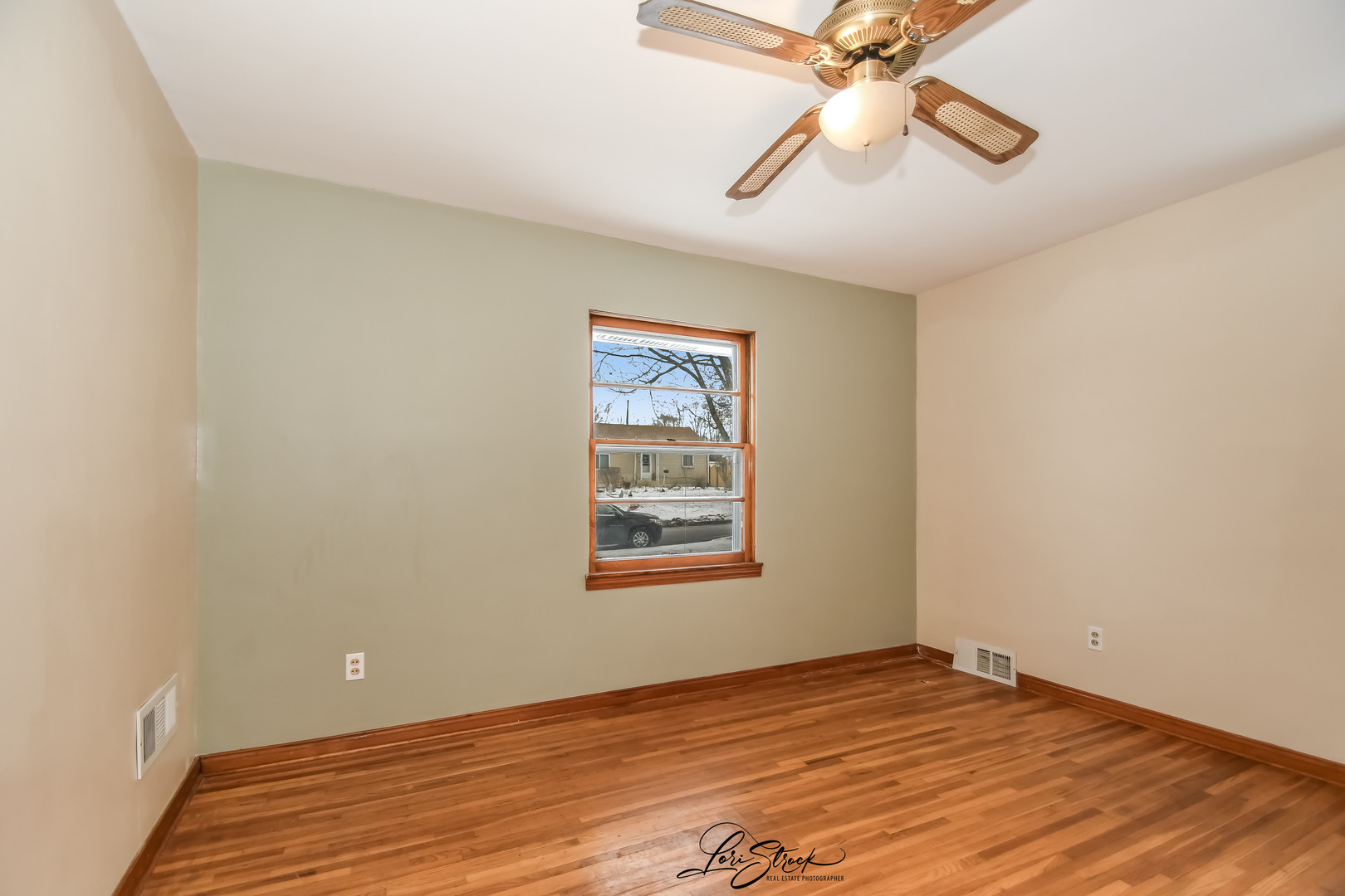 1009 Helen Avenue Joliet, IL 60433 - Photo 10 of 23 a view of an empty room with window and wooden floor