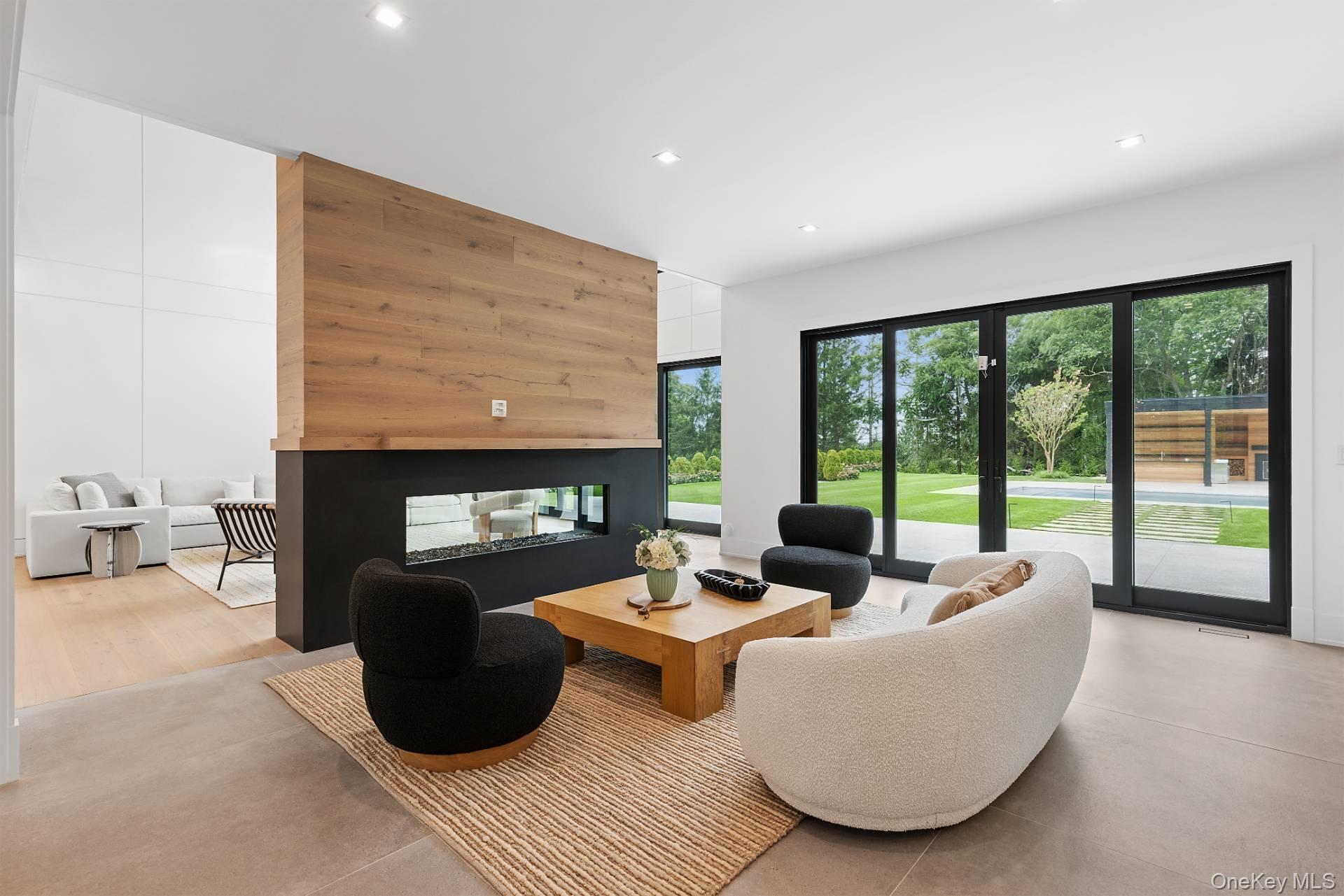 150 Edge Of Woods Road Southampton, NY 11968 - Photo 16 of 47 a living room with furniture and a fireplace