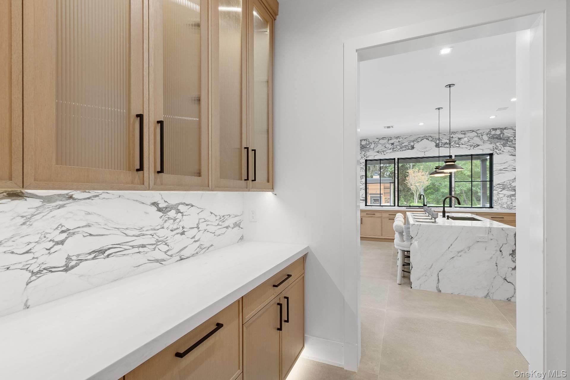 150 Edge Of Woods Road Southampton, NY 11968 - Photo 18 of 47 a bathroom with a sink and a mirror