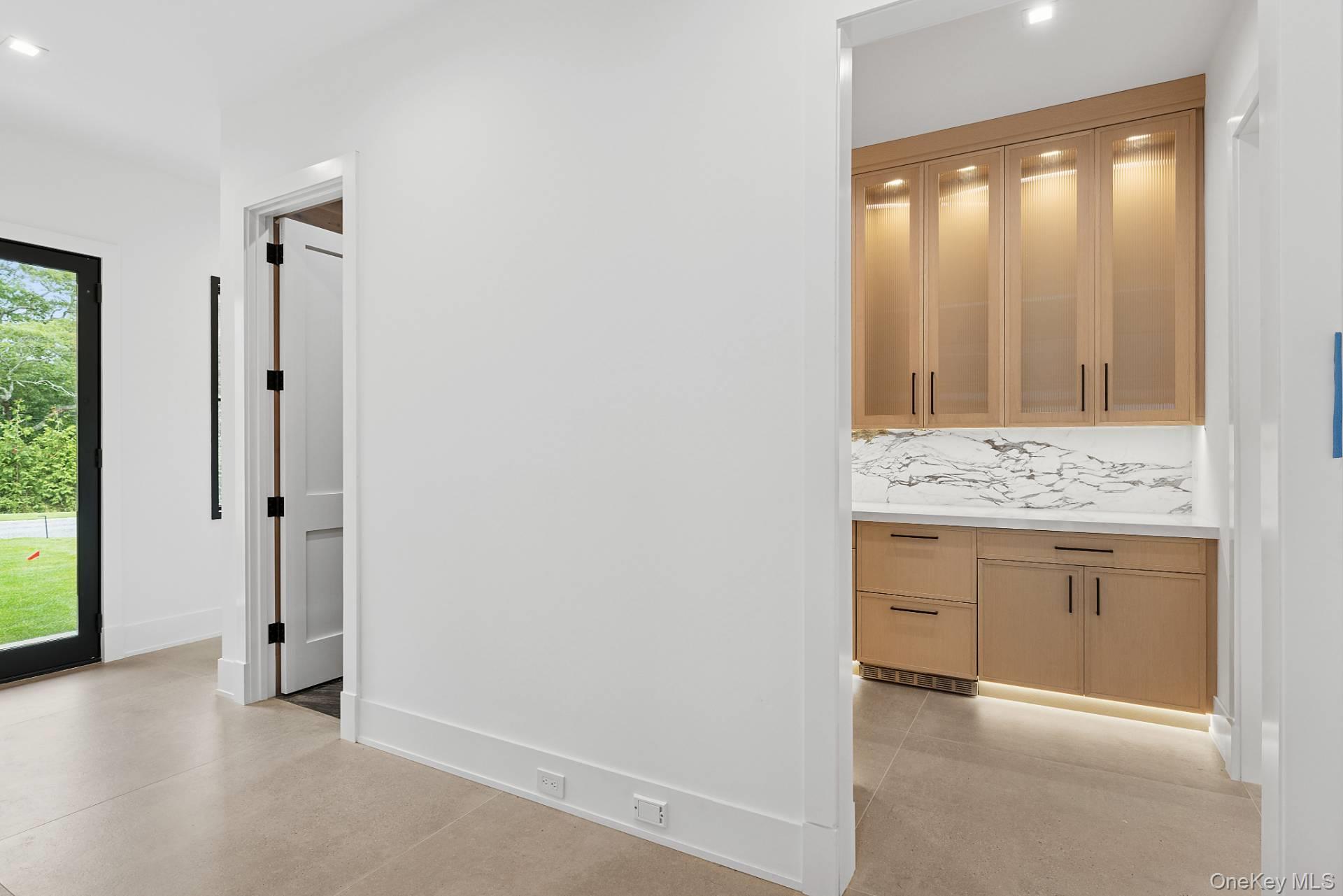 150 Edge Of Woods Road Southampton, NY 11968 - Photo 19 of 47 a bathroom with a sink a vanity and a mirror