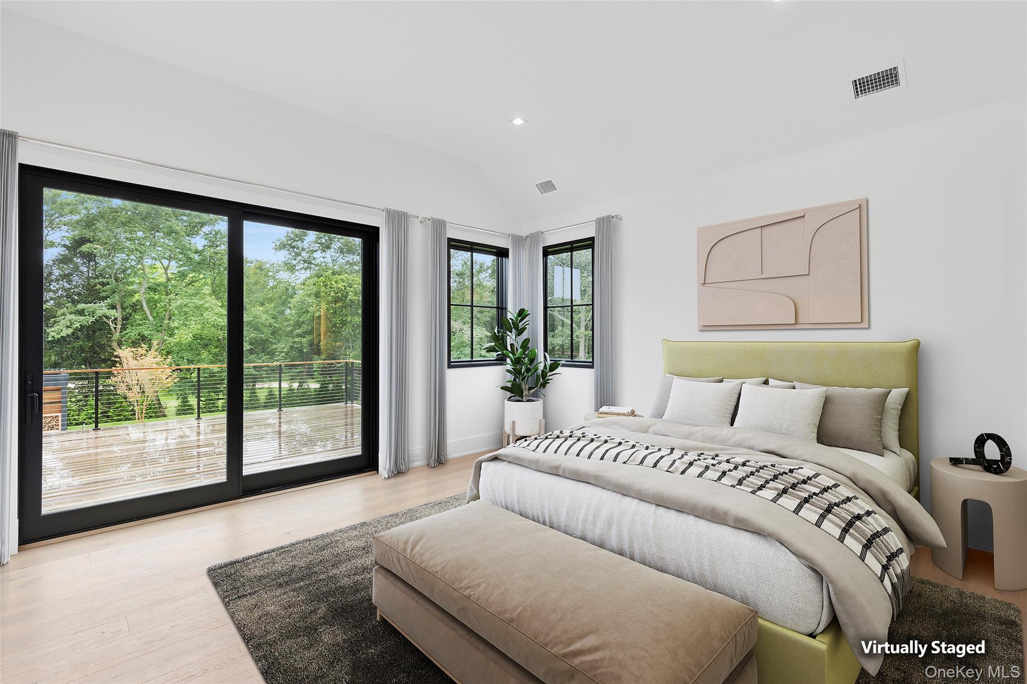 150 Edge Of Woods Road Southampton, NY 11968 - Photo 29 of 47 a bedroom with a large bed and a large window