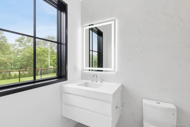 a bathroom with a sink vanity and a mirror