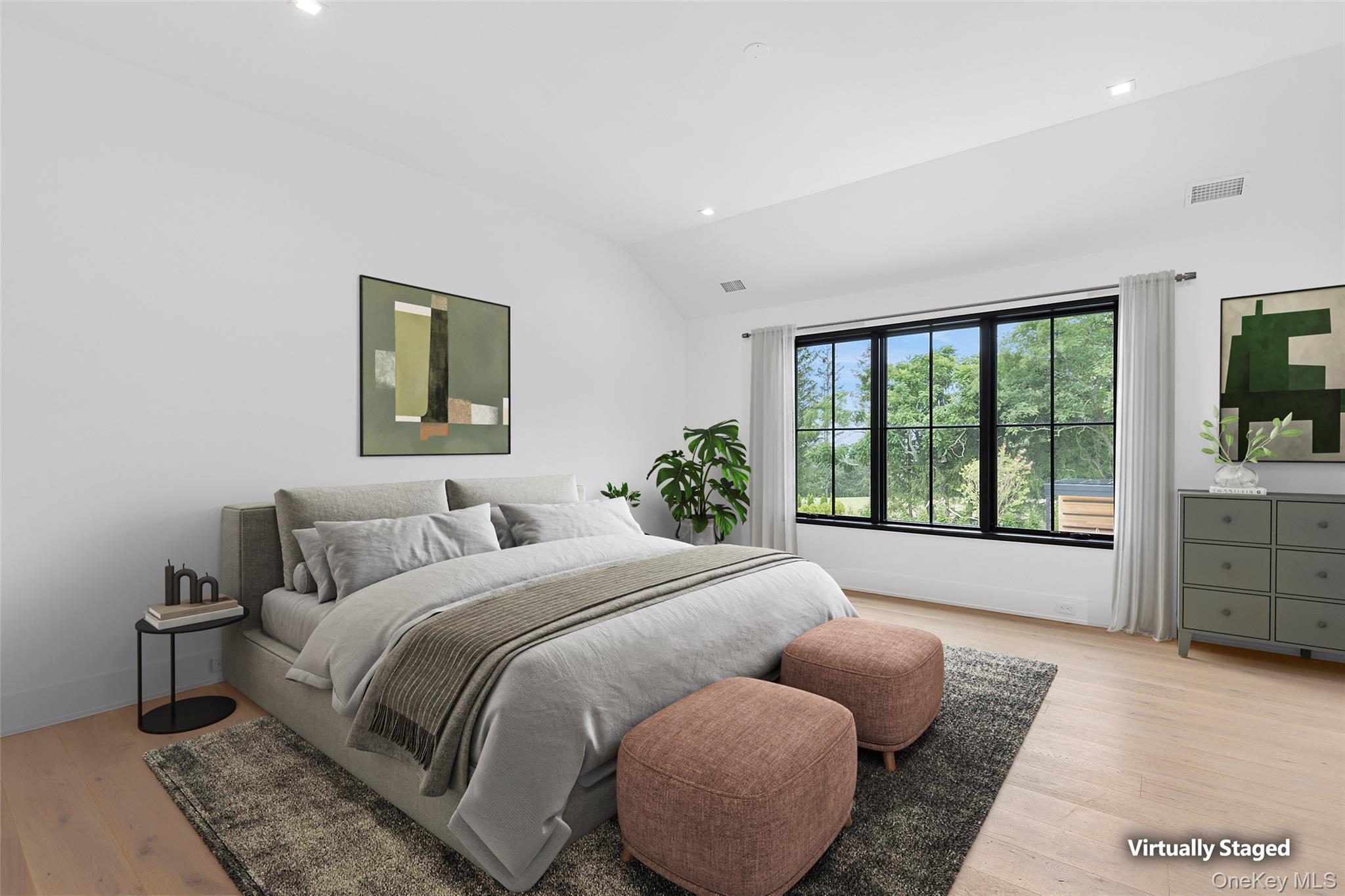 150 Edge Of Woods Road Southampton, NY 11968 - Photo 31 of 47 a bedroom with a bed and a large window