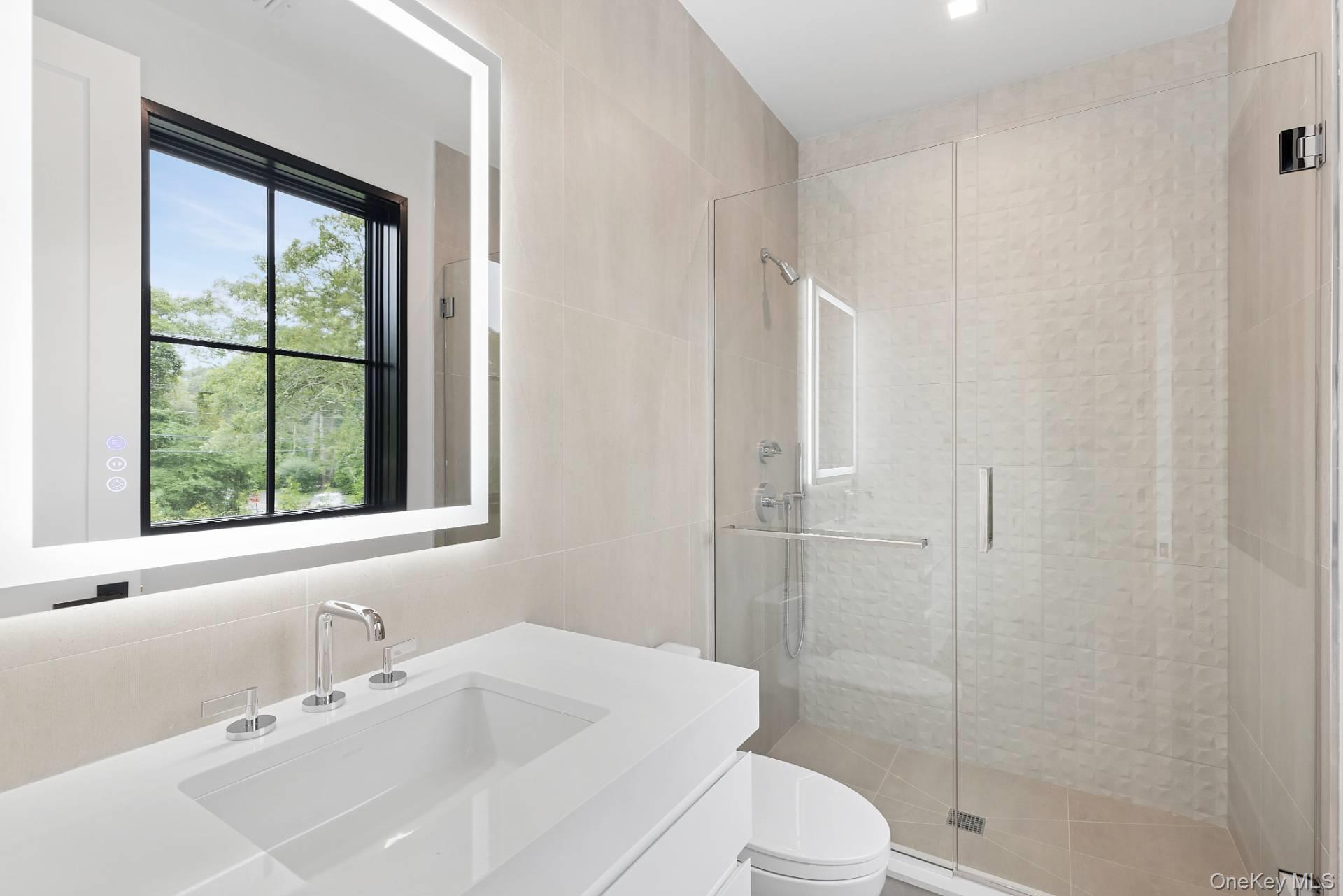 150 Edge Of Woods Road Southampton, NY 11968 - Photo 36 of 47 a bathroom with a sink toilet and shower