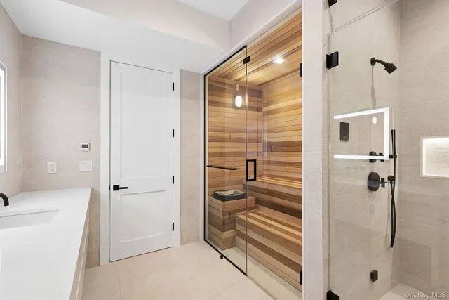 a bathroom with a shower and toilet