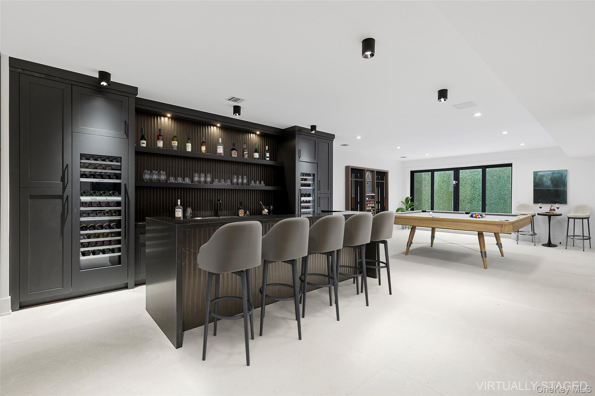 150 Edge Of Woods Road Southampton, NY 11968 - Photo 44 of 47 a dining room with furniture and a floor to ceiling window