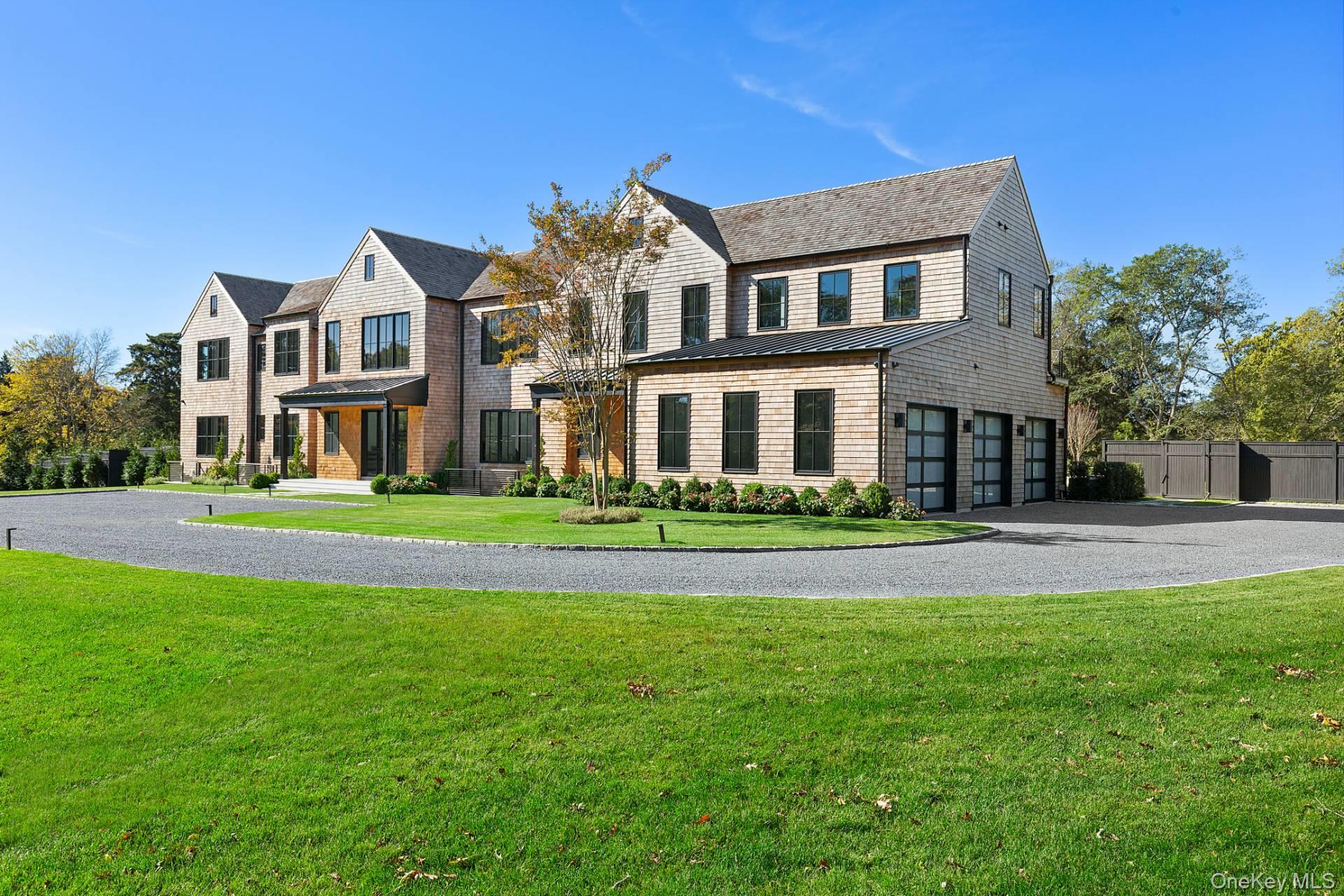 150 Edge Of Woods Road Southampton, NY 11968 - Photo 6 of 47 a front view of a house with a yard