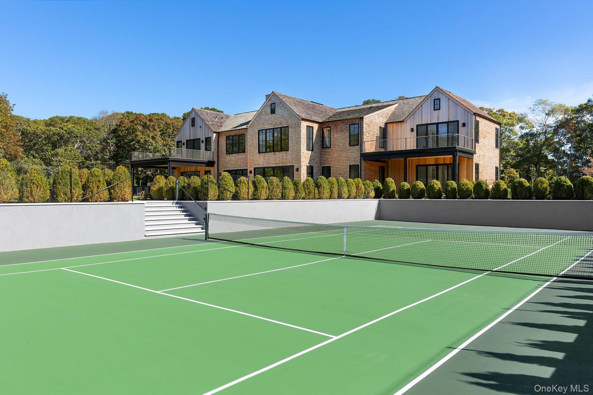 150 Edge Of Woods Road Southampton, NY 11968 - Photo 9 of 47 a view of a tennis court