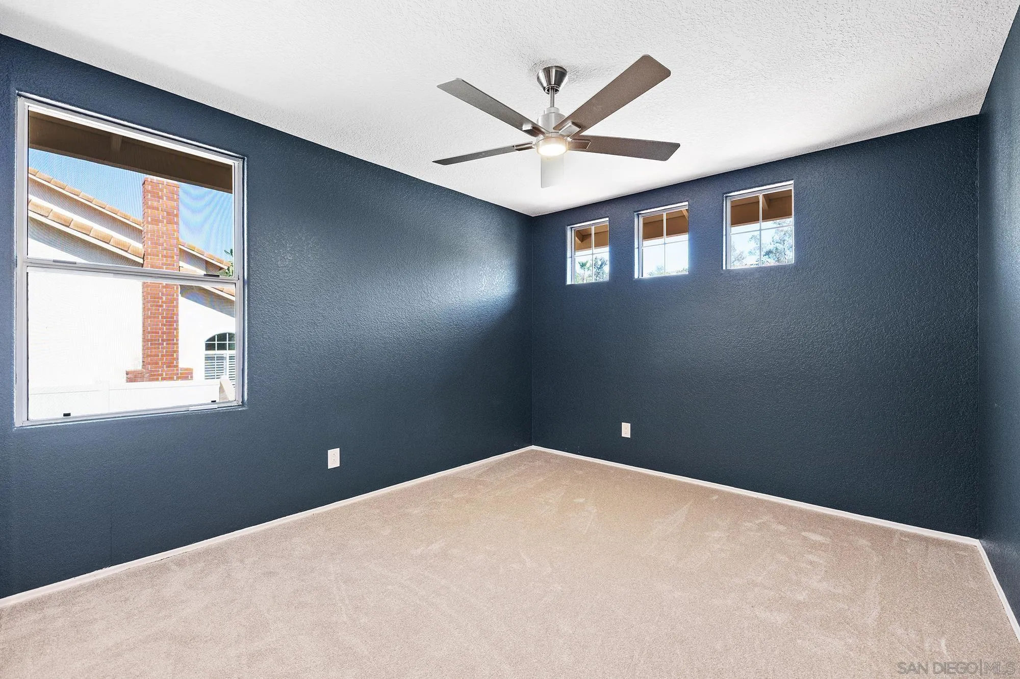 13958 Carriage Road Poway, CA 92064 - Photo 12 of 35 a view of a ceiling fan in a room