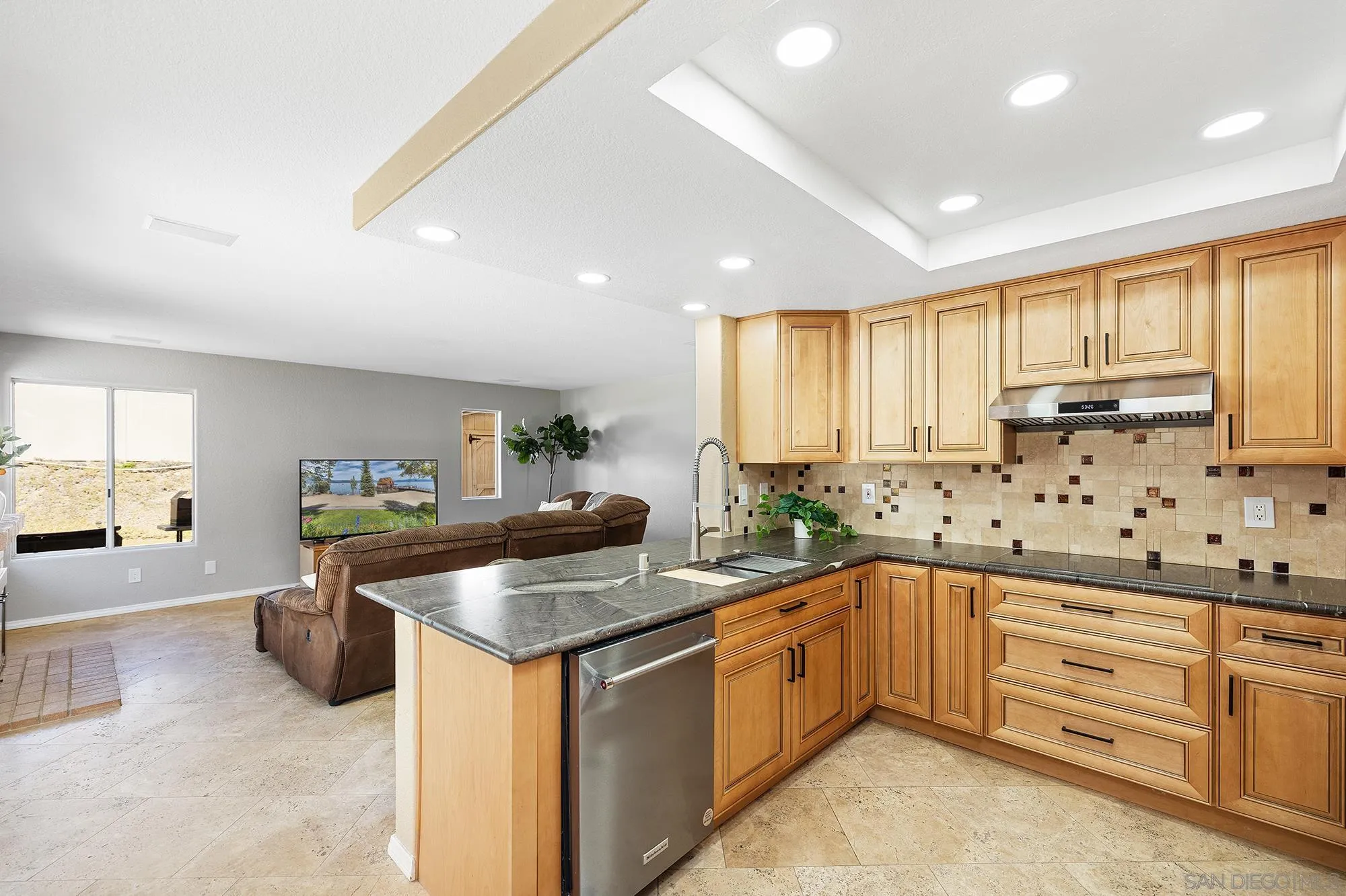 13958 Carriage Road Poway, CA 92064 - Photo 14 of 35 a kitchen with granite countertop a sink and cabinets