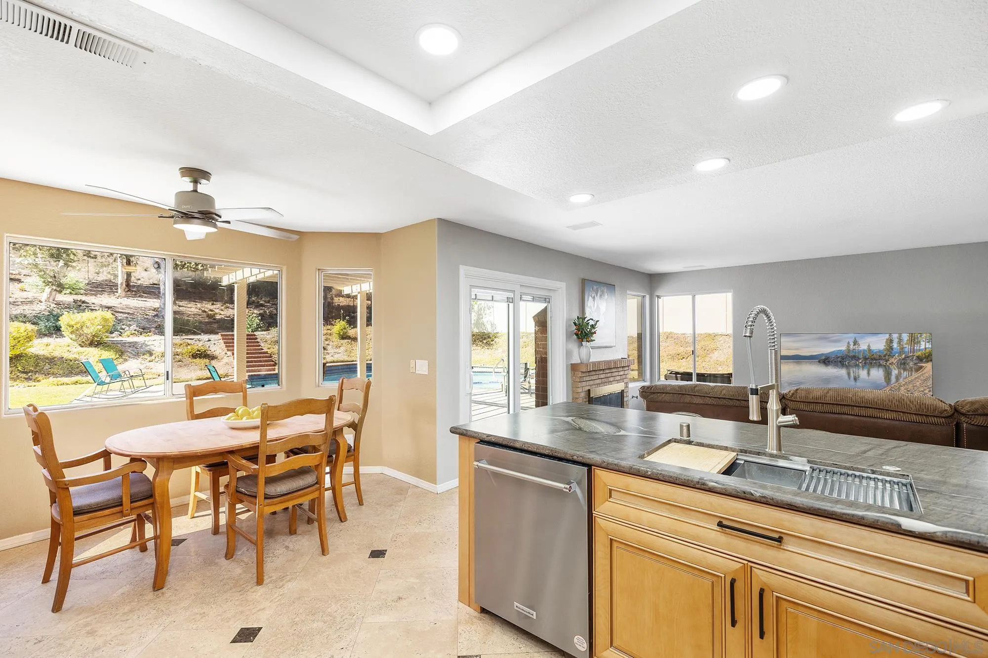 13958 Carriage Road Poway, CA 92064 - Photo 19 of 35 a view of a kitchen with granite countertop a sink and chairs