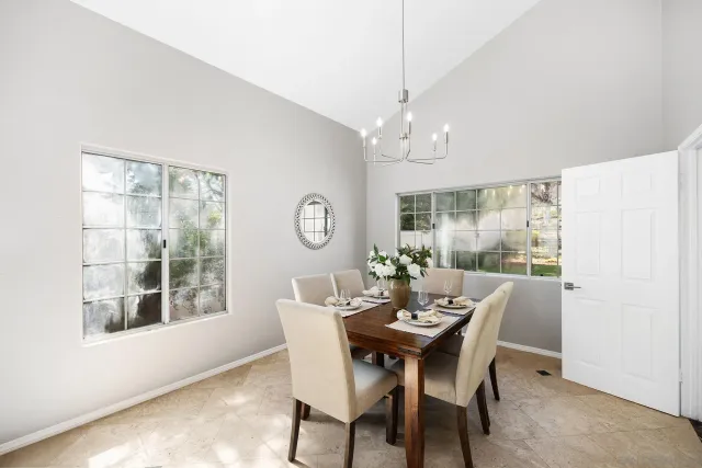 a view of a dining room with furniture window and outside view
