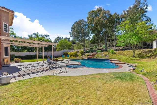 a view of a garden with large tree