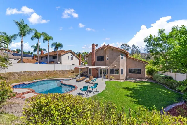 a view of backyard with green space
