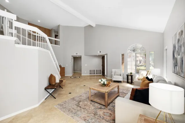 a living room with furniture and white walls