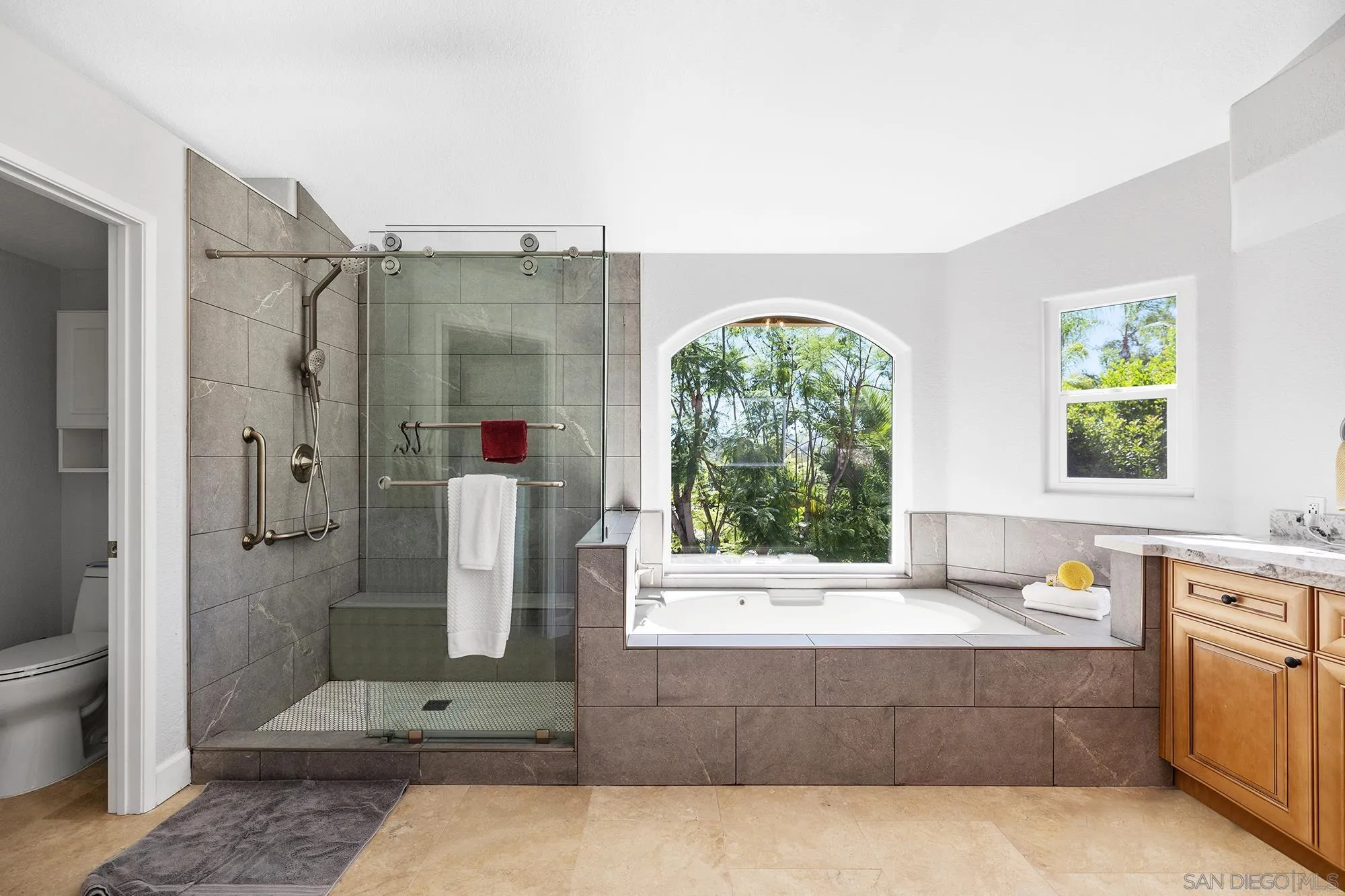 13958 Carriage Road Poway, CA 92064 - Photo 8 of 35 a spacious bathroom with a tub shower and sink
