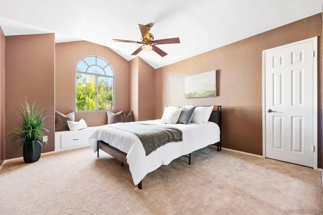 a bed room with a bed and a chandelier