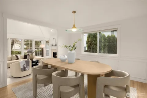 a dining room with furniture and window