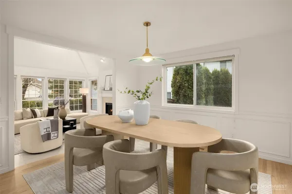 a dining room with furniture and window