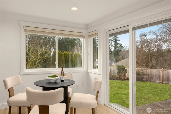 a view of a room that has a bed and a table