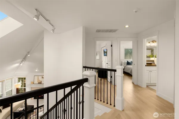 a view of hallway with wooden floor