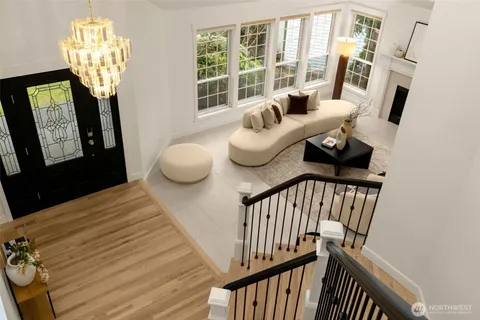 a bedroom with furniture and a chandelier