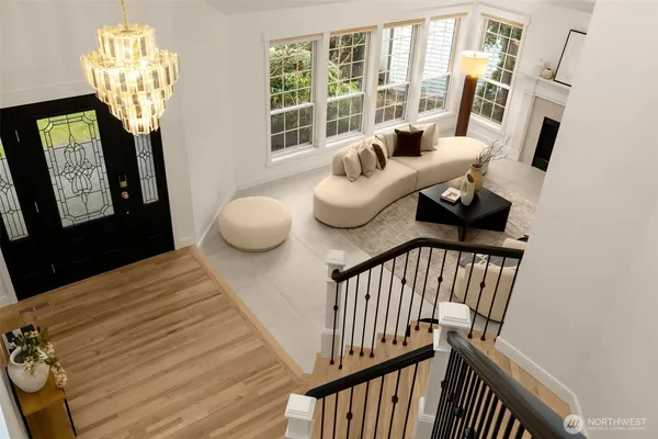 a bedroom with furniture and a chandelier