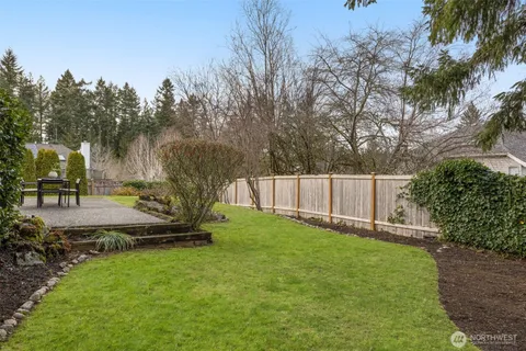 a backyard of a house with lots of green space