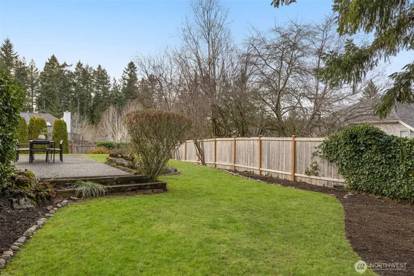 a backyard of a house with lots of green space